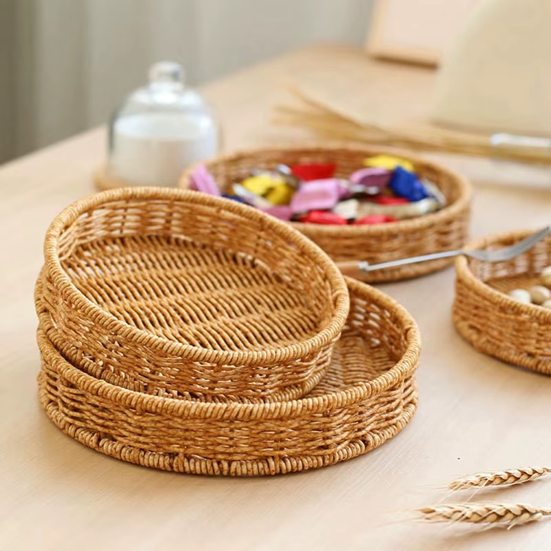 Small round handwoven rattan tray in golden beige
