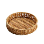 Small round handwoven rattan tray in golden beige