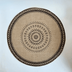 Round hand woven natural jute placemat with warm golden highlights