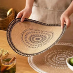 Round hand woven natural jute placemat with warm golden highlights