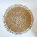 Round tightly woven linen placemat with a straw look texture in white or black