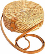 Round structured brown rattan crossbody bag with an adjustable shoulder strap