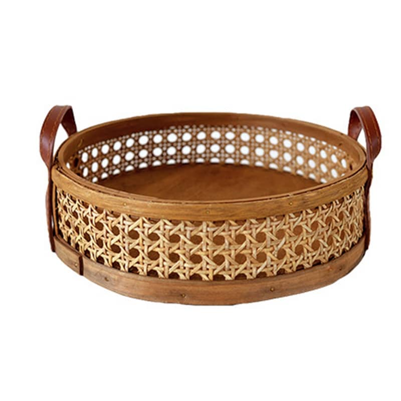 Round low cane webbing basket with leather handles in brown