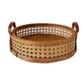 Round low cane webbing basket with leather handles in brown
