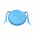 Round polyester seat cushion with tie strings for a rattan chair