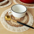 Round hand woven placemat of cotton, corn husk and straw in beige and white