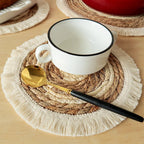 Round hand woven placemat of cotton, corn husk and straw in beige and white