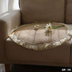 Round woven cotton and linen rug with a cream fringe
