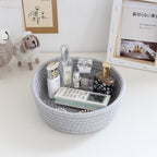 Round white cotton rope storage baskets on a vanity
