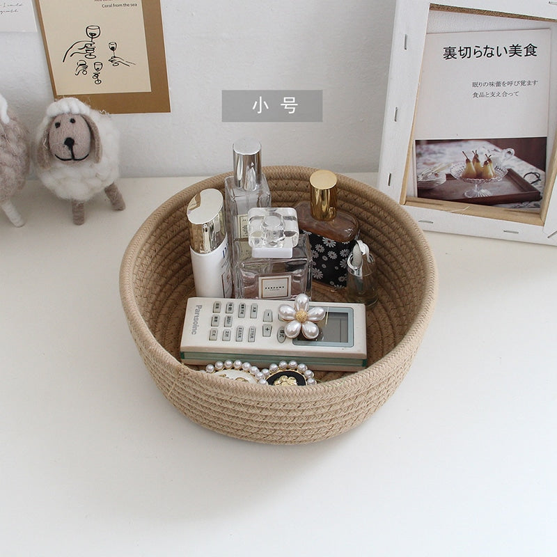 Round white cotton rope storage baskets on a vanity