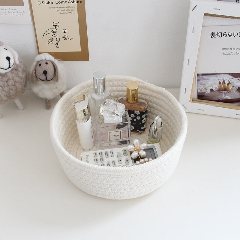 Round white cotton rope storage baskets on a vanity