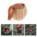 Round woven rattan planter basket with a brown leather look strap