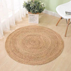 Two round honey braided rugs on a light floor