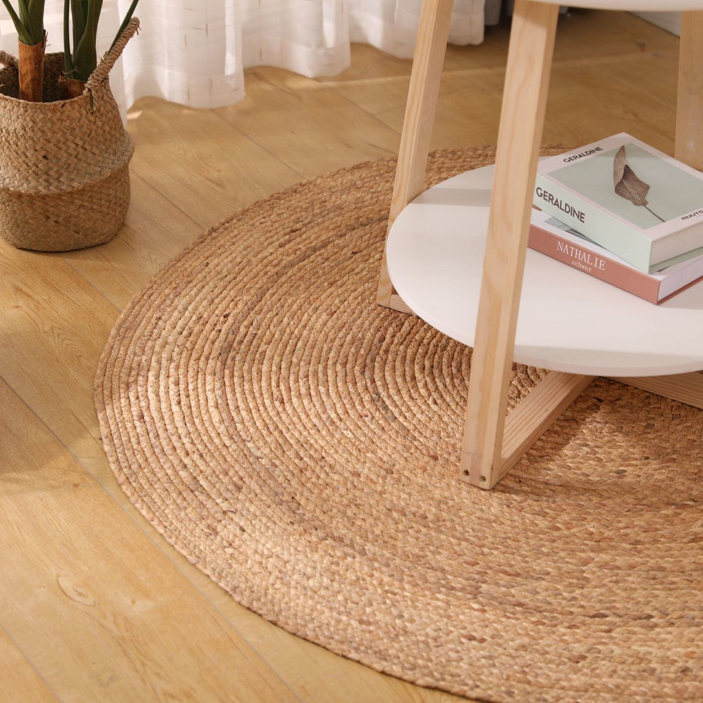 Two round honey braided rugs on a light floor