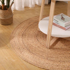 Two round honey braided rugs on a light floor