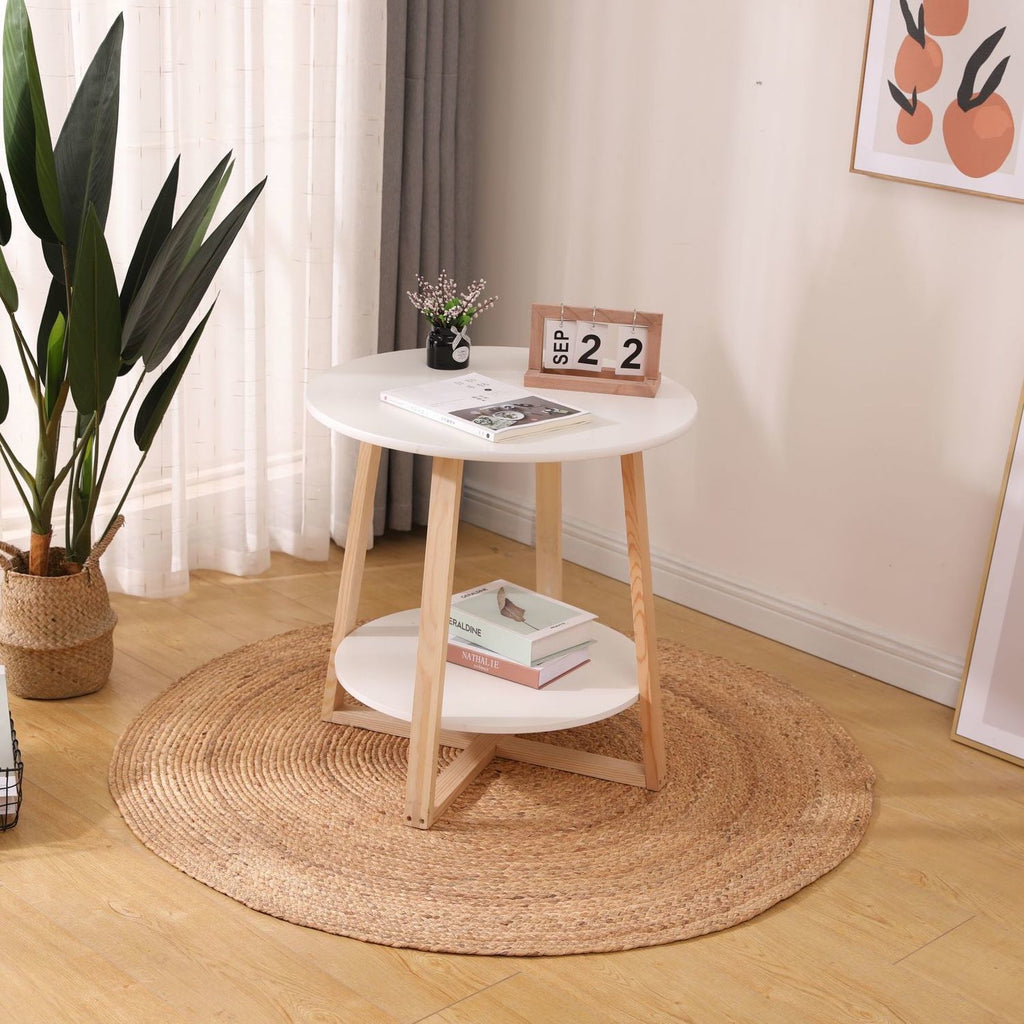 Two round honey braided rugs on a light floor