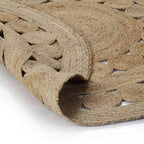Round jute rug with a ring of braided medallions