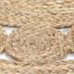 Round jute rug with a ring of braided medallions