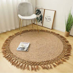 Round jute rug with a tassel fringe in a bright room