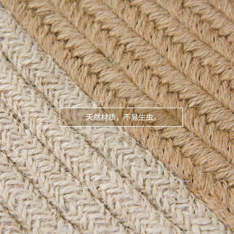 Round jute rug with two white rings under an armchair