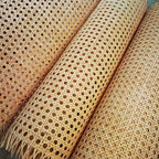 Roll of natural rattan cane webbing with a round open mesh
