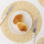 Round sand toned woven linen placemat with a straw look and non slip back