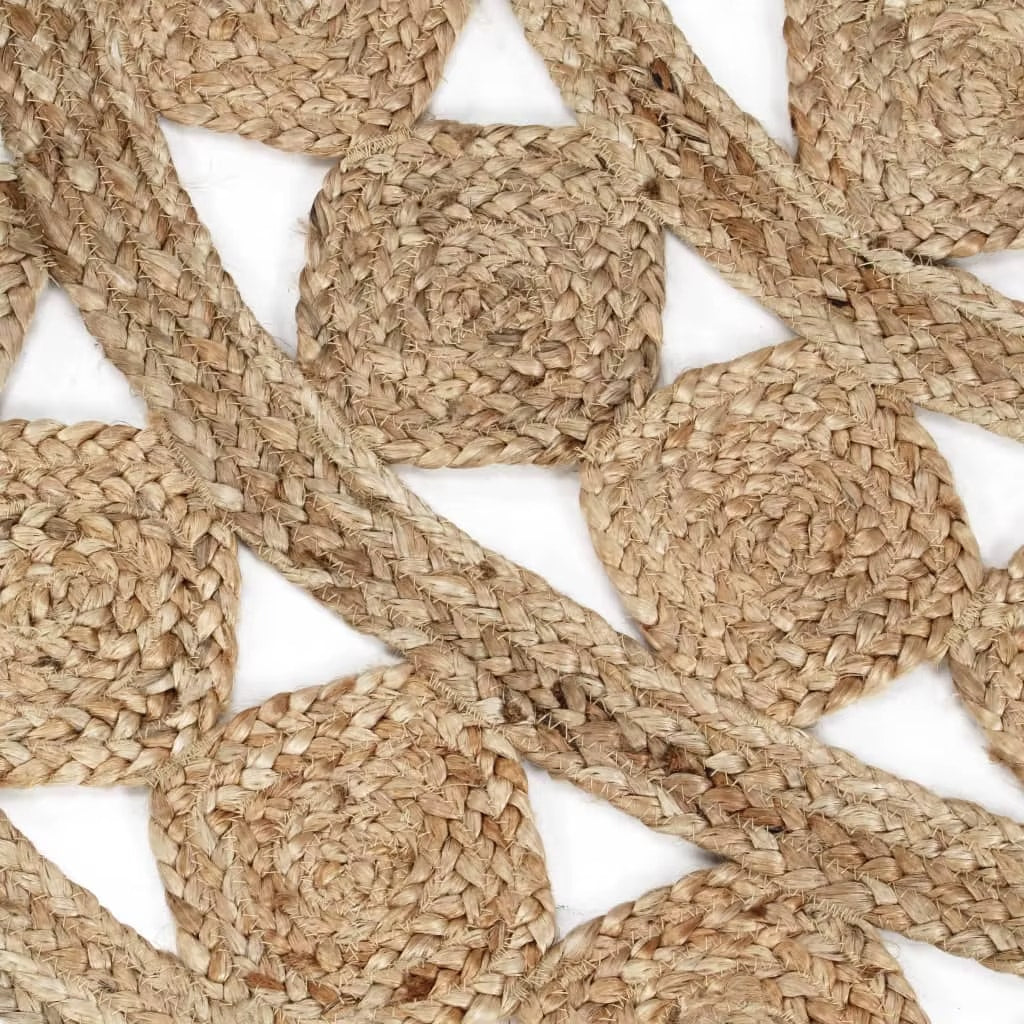 Round jute rug with openwork star patterns