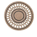 Round openwork woven wall plate with black accents