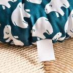 Round chair cushion with white polar bear prints on a deep blue background
