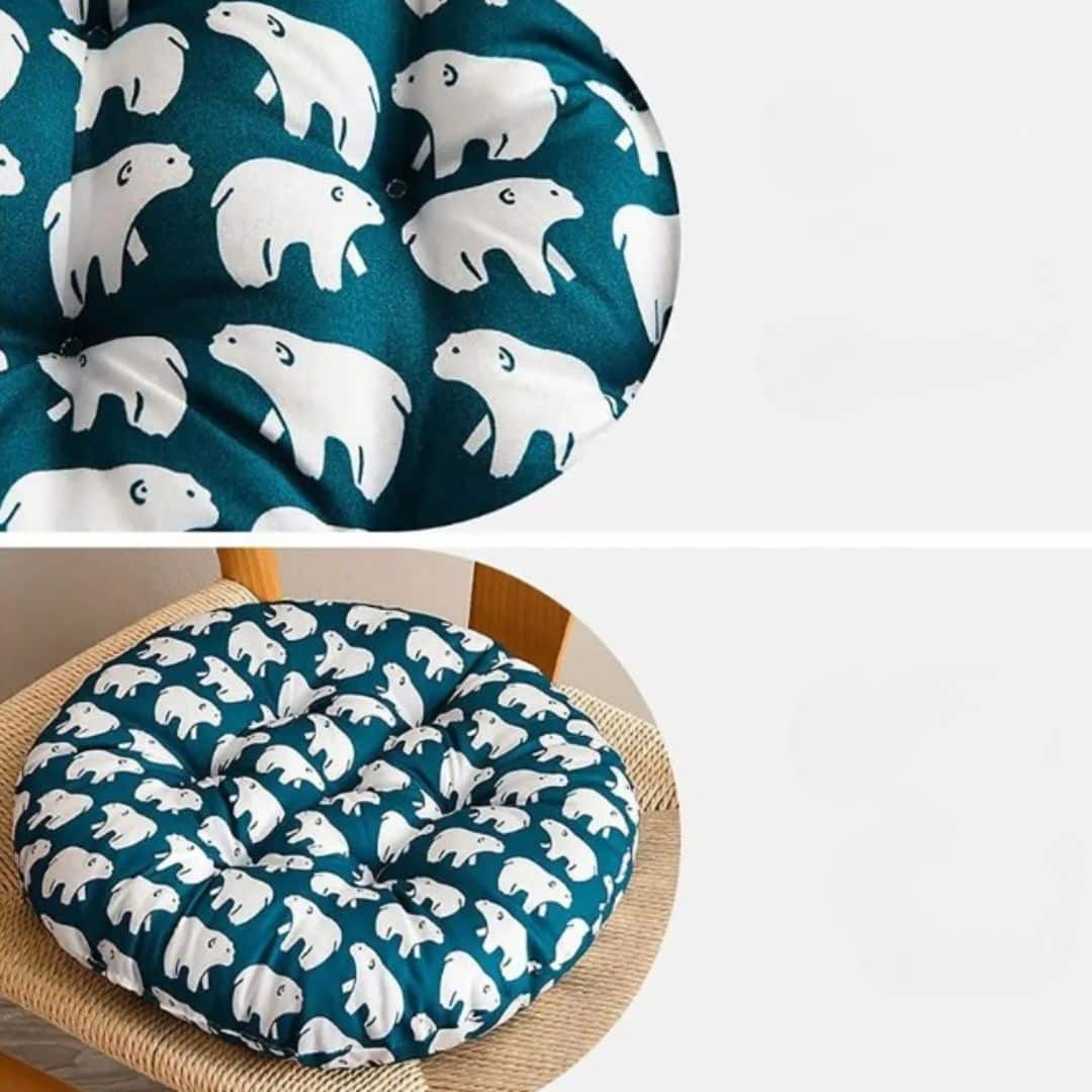 Round chair cushion with white polar bear prints on a deep blue background