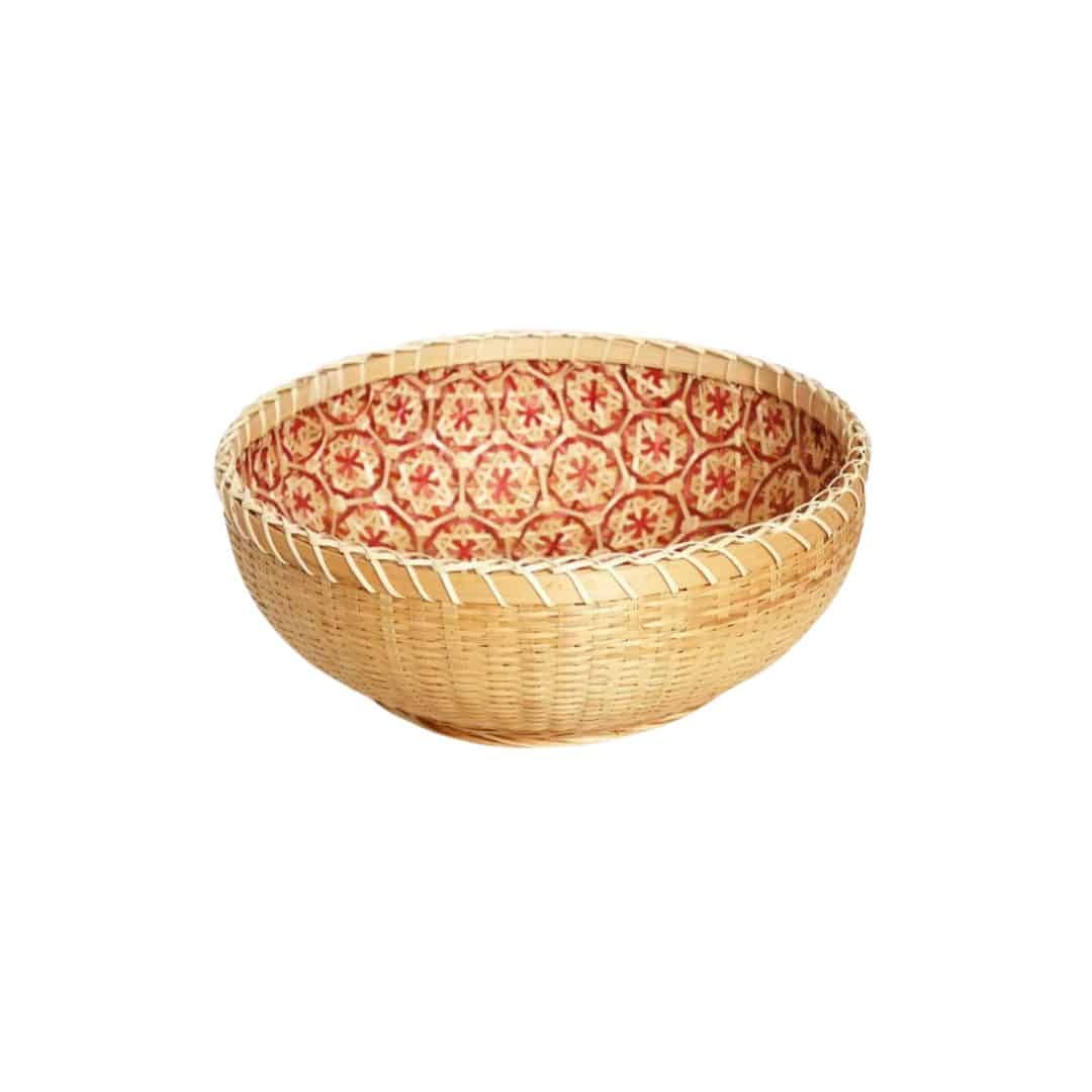 Round rattan bowl basket with orange patterned interior