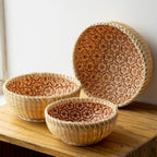 Round rattan bowl basket with orange patterned interior