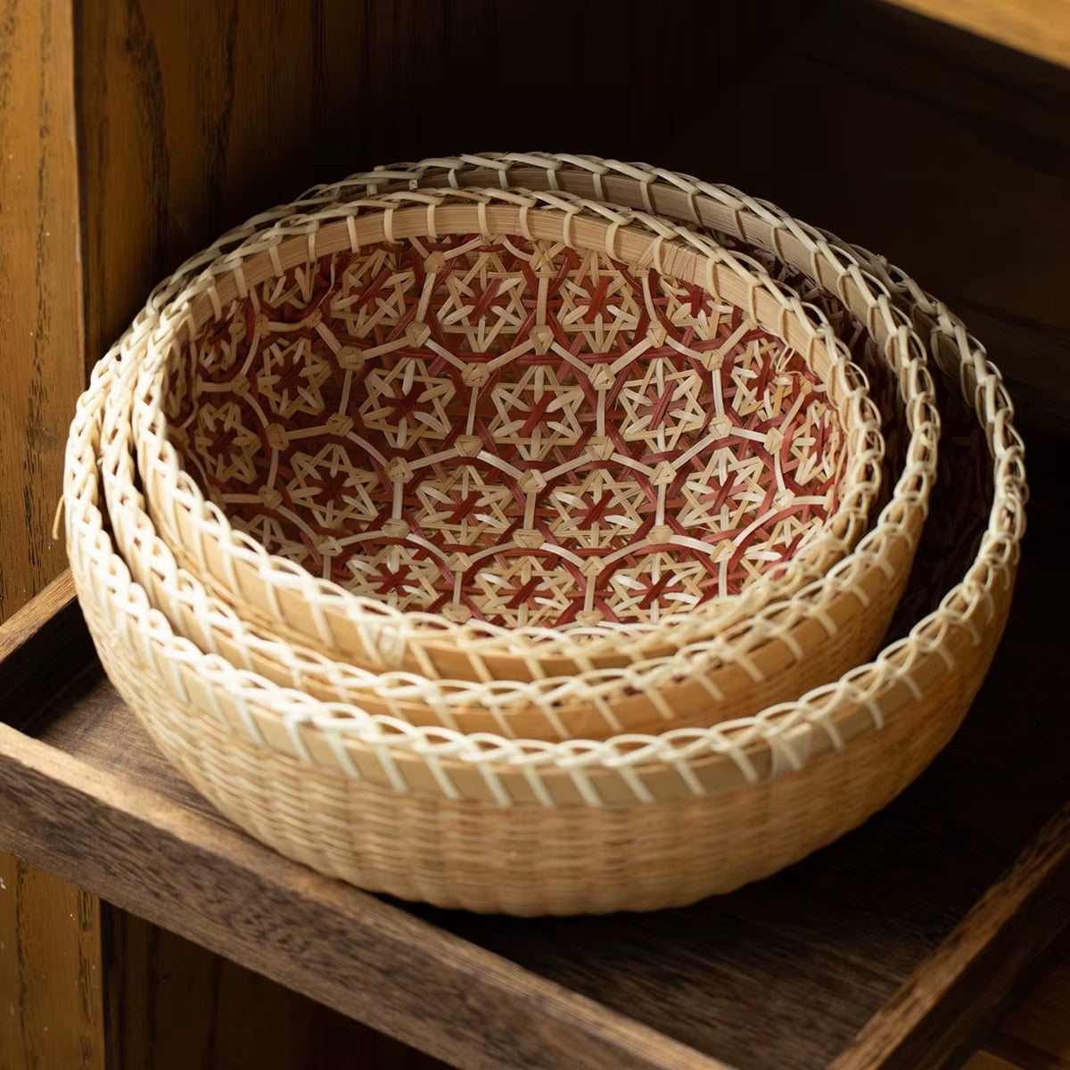 Round rattan bowl basket with orange patterned interior