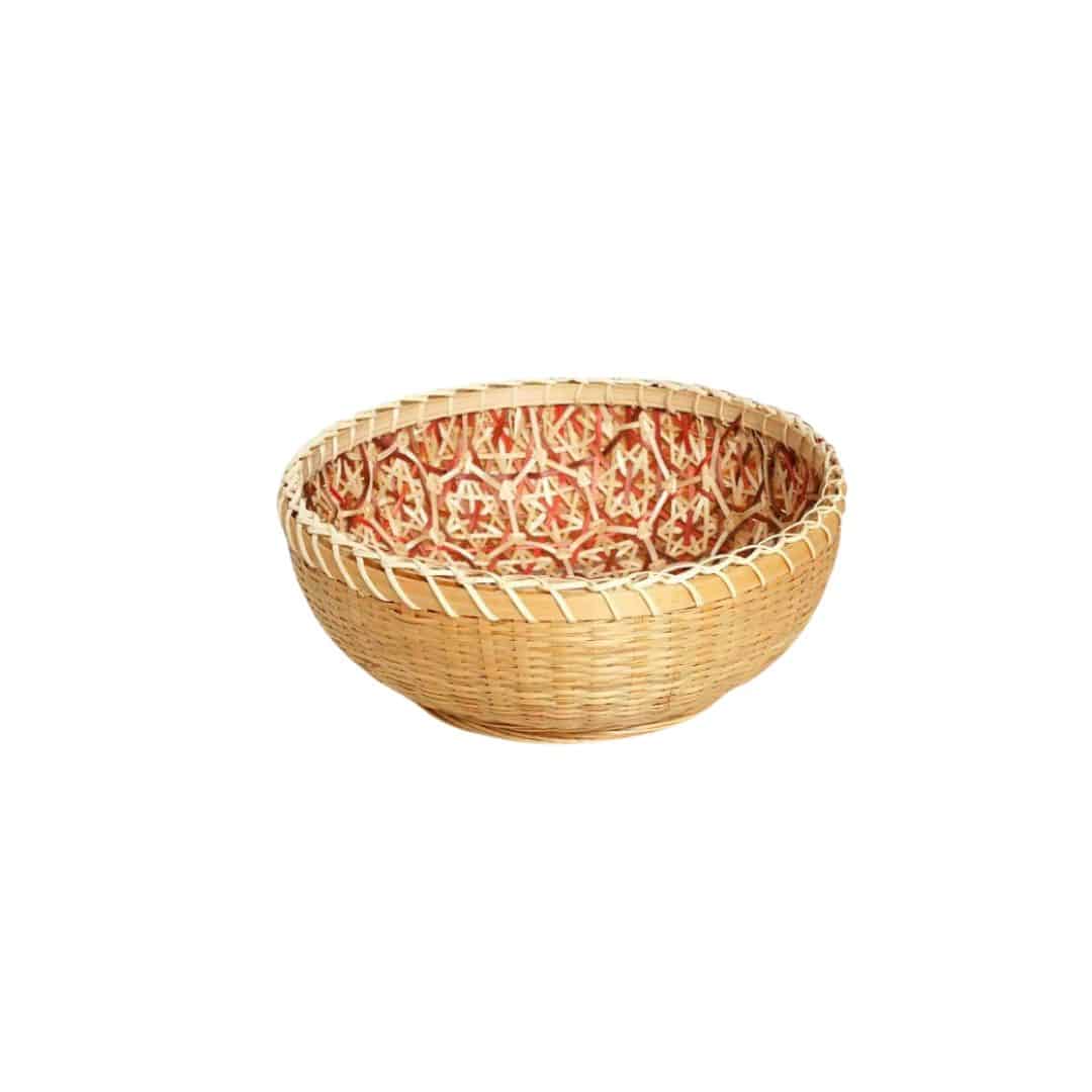 Round rattan bowl basket with orange patterned interior
