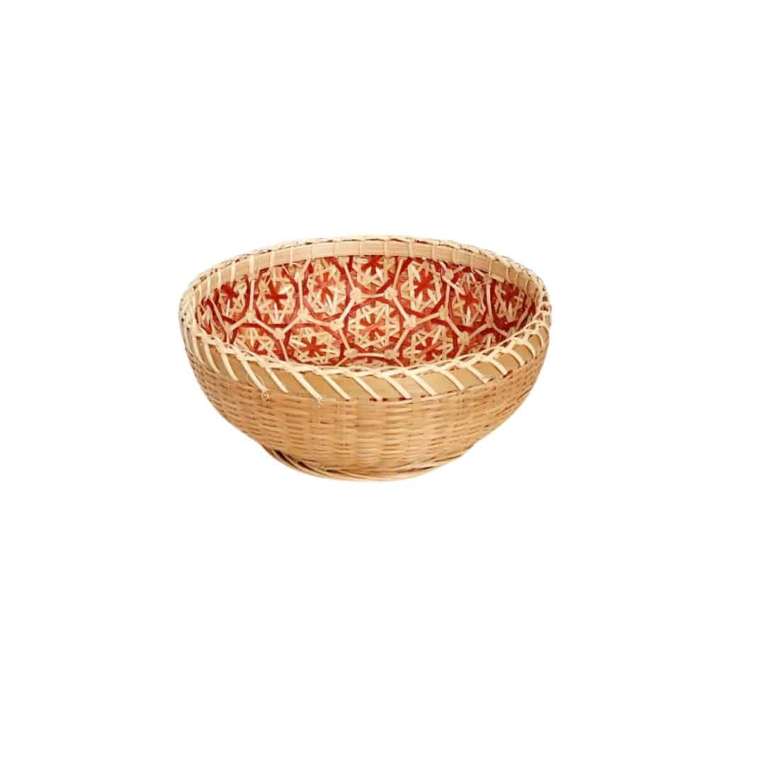 Round rattan bowl basket with orange patterned interior