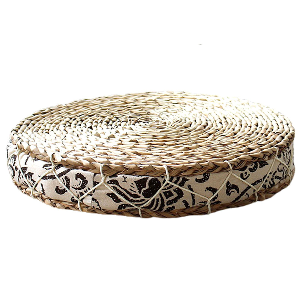 Round hand woven light rattan cushion with a black and white geometric fabric border