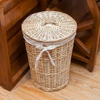 Round rattan laundry hamper with cotton liner and woven lid