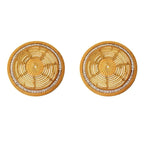 Round beige plastic placemat with a molded woven rattan look