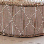 Round hand woven rattan pouf with a beige fabric band