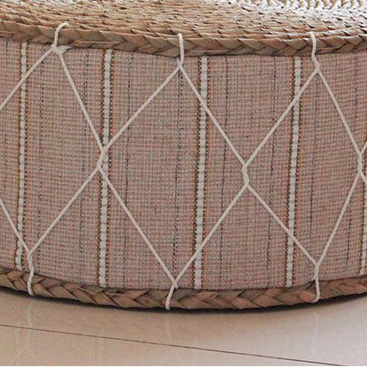Round hand woven rattan pouf with a beige fabric band