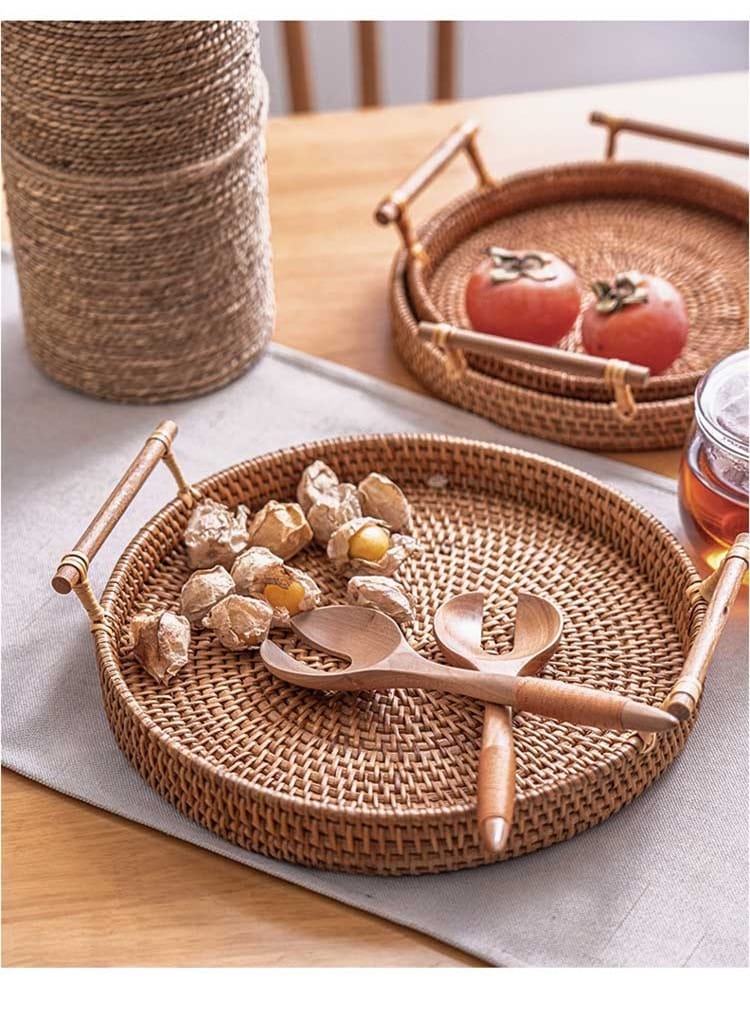 Round rattan serving tray with solid wooden handles