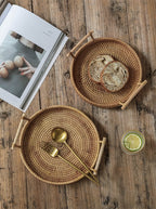 Round rattan serving tray with solid wooden handles