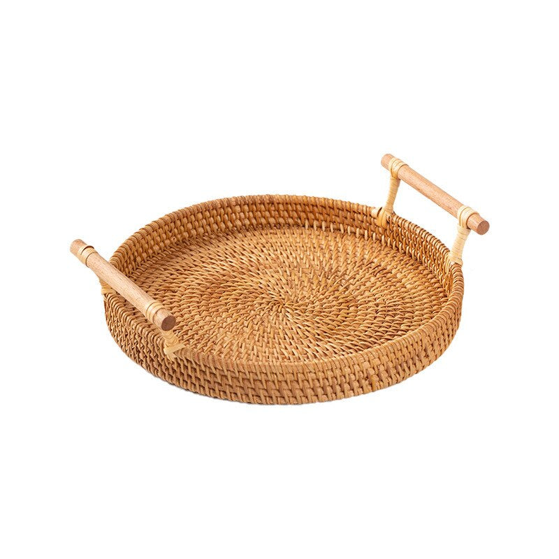 Round rattan serving tray with solid wooden handles