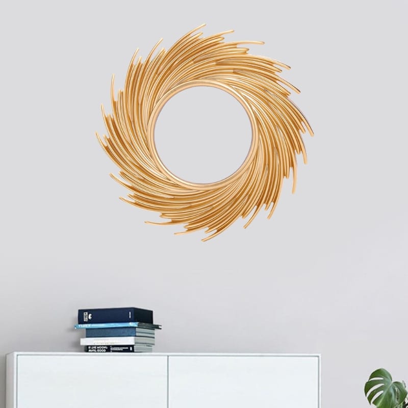 Round mirror framed by swirling rattan rays