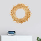 Round mirror framed by swirling rattan rays