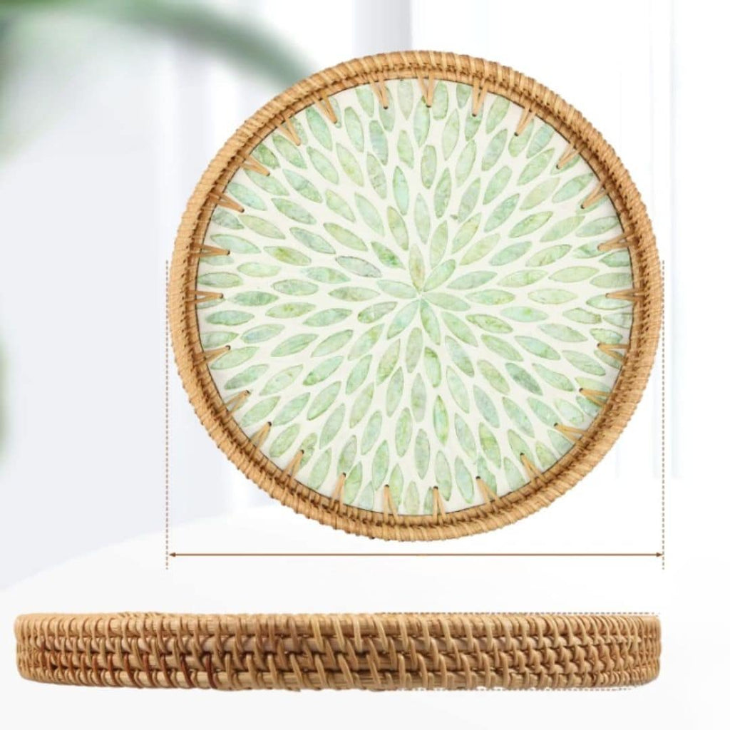 Round rattan tray with green leaf pattern and woven border