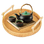 Round handwoven rattan tray with an arched center handle