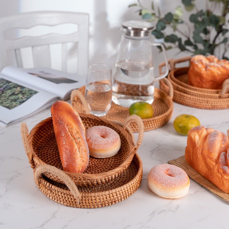 Round handwoven rattan tray with two side handles