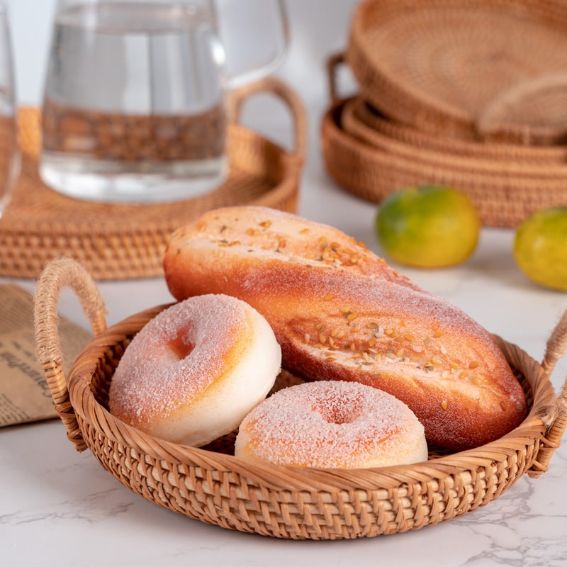 Round handwoven rattan tray with two side handles