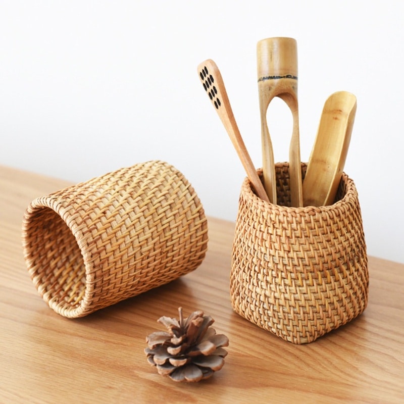 Round honey rattan cups holding wooden utensils